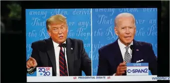  ?? Photo: ?? U.S. President Donald Trump (left) and his Democratic challenger, Joe Biden, speaking during their first debate in the 2020 presidenti­al race. Xinhua