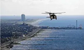  ?? Michael Ciaglo / Houston Chronicle file ?? One proposal for the Ike Dike storm surge barrier includes covering a structure with sand dunes to create a natural habitat and protect beachfront homes.