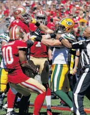  ?? Carlos Avila Gonzalez / The Chronicle ?? Joe Staley (rear left) and the Packers’ Clay Matthews drew offsetting dead-ball penalties.