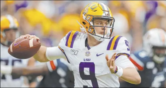  ?? Gerald Herbert The Associated Press ?? The betting Joes are banking on the strong arm of Louisiana State quaterback Joe Burrow in Monday’s CFP national title game.