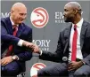  ?? CURTIS COMPTON/AJC 2018 ?? Hawks general manager Travis Schlenk (left) fired coach Lloyd Pierce before Pierce had a chance to coach the full roster put together by Schlenk because of injuries to rotation players.