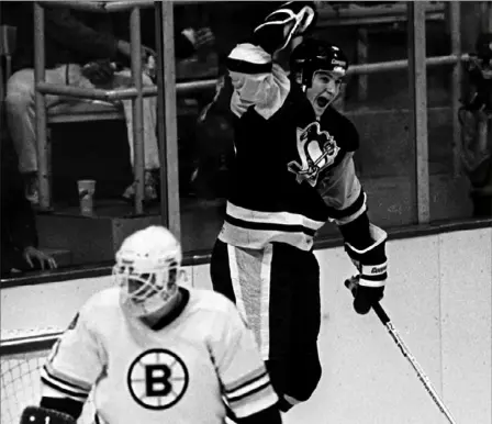  ?? Associated Press ?? When it all began: Mario Lemieux reacts after scoring career goal No. 1 vs. Boston’s Pete Peeters on Oct. 12, 1984.
