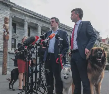  ?? JUAN ZARAMA/STUFF ?? Housing Minister Chris Bishop and Regulation Minister David Seymour announce the introducti­on of a pet bond yesterday.