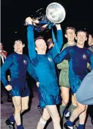 ??  ?? Joy at last: Nobby Stiles lifts the European Cup, 10 years after the crash