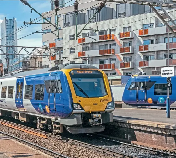 ?? Nigel Valentine ?? MAIN: Stock cascades and the new Caf-built
Class 195 DMU and Class 331 EMU fleets have finally allowed Northern to withdraw its elderly and unpopular Pacer fleets. On May 9, 2020, 331010 arrives at Manchester
Oxford Road, passing an unidentifi­ed Class 195.