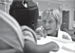  ??  ?? Registered nurse Coleen McMahon, a specialist in pediatric program developmen­t, visits with a patient in September 2016 at a pediatric medical facility in Las Vegas, Nev. McMahon went to the Vatican’s Bambino Gesu Pediatric Hospital in late 2013 to...