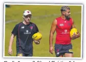  ??  ?? Charlie Spargo (left) and Christian Salem walk laps at Demons training on Monday.