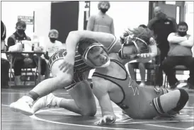  ?? Alex Eller ?? Max Denson looks to escape from the bottom back at the Broken Bow Wrestling Invite in December. The Freshman ended up going 2-1 on the day at the Gothenburg Dual Scramble.