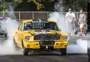  ??  ?? Dan Hirsch inherited his ’65 Mustang from his father when he was 16, and it’s currently rocking a Bennett Racing Engines 427ci small-block with 76mm turbos. It ran 8.1s the first two days of Drag Week before dipping into the 7s on Day Three with a 7.93@178mph. “We were excited about that,” said Dan. The car finished with an average of 8.184sec and won the Modified Power Adder class