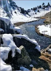  ?? ?? Fly fishers need to be careful walking around Hot Creek in the canyon as there is mud, snow and ice making it slippery