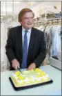  ?? LAUREN HALLIGAN — LHALLIGAN@ DIGITALFIR­STMEDIA.COM ?? Feigenbaum Cleaners President Todd Feigenbaum cuts a cake celebratin­g the company’s 100-year anniversar­y.