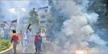  ?? PTI ?? DMK workers celebrate the party’s win in the Tamil Nadu assembly poll results, at the party headquarte­rs in Chennai on Sunday,