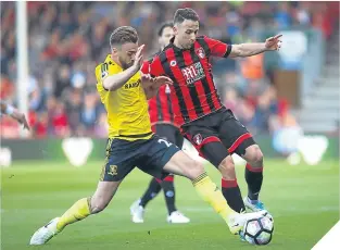  ??  ?? Calum Chambers and Marc Pugh battle for possession.