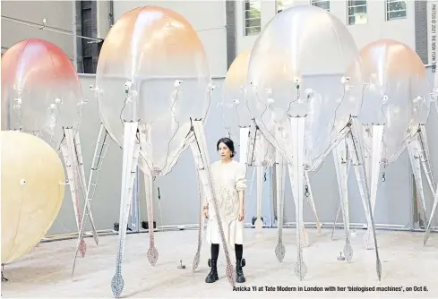  ?? ?? Anicka Yi at Tate Modern in London with her ‘biologised machines’, on Oct 6.