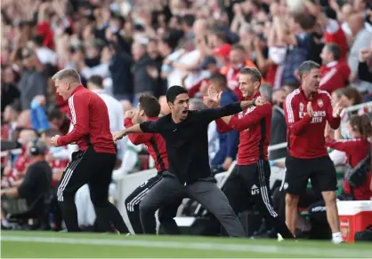  ?? Julian Finney/Getty Images ?? Mikel Arteta celebrates his team’s second goal in the derby victory against Spurs at the Emirates Stadium last September. Photograph: