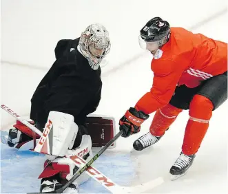  ?? LAKE FONG/PITTSBURGH POST-GAZETTE ?? Sidney Crosby and goaltender Carey Price, seen at practice on Tuesday, are both keenly aware of the historic hockey rivalry between Canada and Russia, whose teams meet Wednesday for a pre-tournament World Cup of Hockey game.