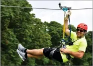  ?? AP PHOTO BY SHANNON SEPER ?? In this undated photo shows Seper on a zipline at Eco Adventure Ziplines in New Florence, Mo.