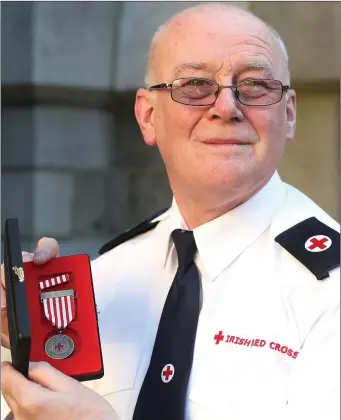  ??  ?? Local man Aidan Maguire has been honoured for his 40 years of service to the Irish Red Cross.