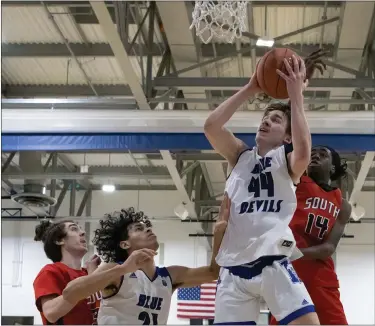  ?? SENTINEL & > ENTERPRISE / GARY FOUNIER ?? Leominster’s Chase Hause pulls down a rebound during Monday’s game against South.