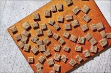  ?? STACY ZARIN GOLDBERG/THE WASHINGTON POST ?? Honey-sesame squares: What is it about candy that has this nostalgic strangleho­ld on us?
