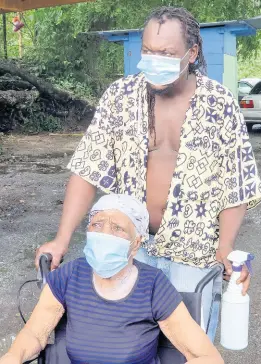  ?? CONTRIBUTE­D ?? Dorothy Lee of Port Morant, St Thomas, is wheeled into the polling division by her son-in-law, Richard Johnson.