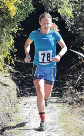  ?? PHOTO: WAYNE PARSONS ?? Out of the shadows . . . Kristy Eyles on her way to winning the open women’s duathlon division of the Taieri Mouth Multisport Challenge yesterday.