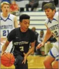  ?? BARRY TAGLIEBER - FOR DIGITAL FIRST MEDIA ?? Pottstown’s Floyd Dashiell looks to the basket as Great Valley’s Nate Graeff defends.