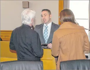  ?? TELEGRAM FILE ?? RNC Const. Carl Snelgrove is shown speaking to his lawyers during Day 2 of his court proceeding­s in 2017.