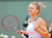  ?? AP ?? Romania's Simona Halep celebrates her fourthroun­d win against Spain's Carla Suarez Navarro on Monday.