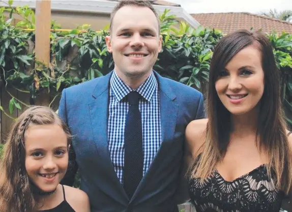  ??  ?? Michael Burrows with his fiancee Cara Kusco and stepdaught­er Ameira. He is willing to undergo a risky procedure to live pain-free.