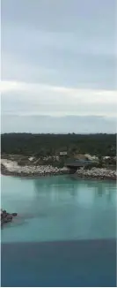  ??  ?? A view of Castaway Cay, Disney’s private island in the Bahamas, from the Disney Magic. Blue fish in the shallow waters off the island swam up to visitors as if they had been trained by Disney.