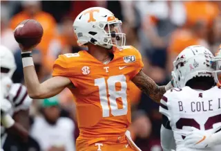  ?? AP Photo/Wade Payne ?? ■ Tennessee quarterbac­k Brian Maurer (18) throws to a receiver in the first half against Mississipp­i State on Saturday in Knoxville, Tenn.