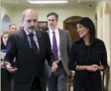  ?? RAAD ADAYLEH — THE ASSOCIATED PRESS ?? Nikki Haley, center, US ambassador to the United Nations, speaks to Jordanian Foreign Minister Ayman al-Safadi in Amman, Jordan on Monday. Haley is pledging additional support for refugees fleeing Syria’s long civil war.