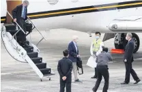  ?? PHOTO: CENTRAL NEWS AGENCY/POOL VIA REUTERS ?? Show of support . . . American Institute in Taiwan (AIT) director Brent Christense­n welcomes former United States senator Chris Dodd and former US deputy secretary of state Jim Steinberg (on stairs) at Songshan airport in Taipei, Taiwan, yesterday.