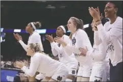  ?? The Associated Press ?? FIGHTING IRISH: The Notre Dame bench celebrates during the second half of the Spokane Regional semifinal win over Texas A&M Saturday in Washington.