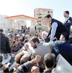  ??  ?? Rouhani visits Sarpol-e Zahab county in Kermanshah in Iran that was hit by a powerful earthquake. — Reuters photo