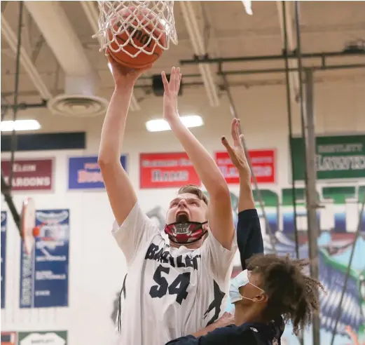  ?? ALLEN CUNNINGHAM/SUN-TIMES ?? Bartlett 7-3 center Conrad Luczynski had 16 points and six rebounds while playing only half the game Thursday against West Chicago.