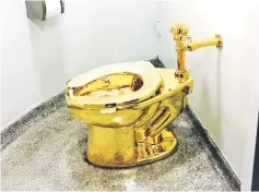  ?? — AFP photo ?? File photo shows a fully functionin­g solid gold toilet, made by Maurizio.