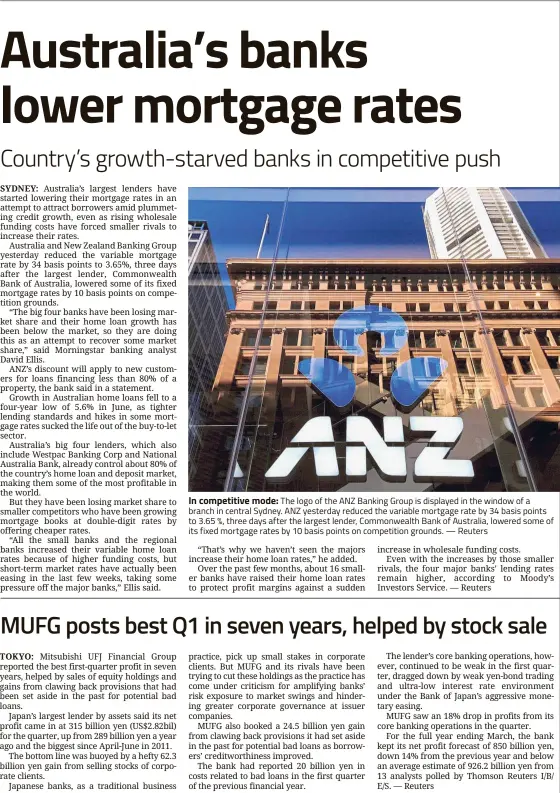  ??  ?? In competitiv­e mode: The logo of the ANZ Banking Group is displayed in the window of a branch in central Sydney. ANZ yesterday reduced the variable mortgage rate by 34 basis points to 3.65 %, three days after the largest lender, Commonweal­th Bank of...