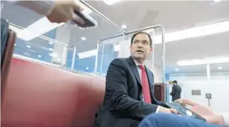  ?? CAROLYN KASTER/AP ?? Sen. Marco Rubio talks to a reporter on the subway on Capitol Hill in Washington on Nov. 4.