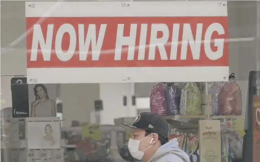  ?? JEFF CHIU/ AP FILE ?? In the near term, economic activity is likely to slow further, an economist survey finds, but expectatio­ns are growing for growth in late 2021.