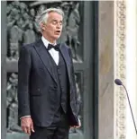 ??  ?? This photo taken on April 12, 2020 shows Italian tenor and opera singer Andrea Bocelli sing during a rehearsal on a deserted Piazza del Duomo in central Milan.—AFP