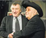  ??  ?? The Associated Press file In 2005, Robert De Niro, left, who played Jake Lamotta in “Raging Bull” and Lamotta meet in New York for a 25th anniversar­y screening.