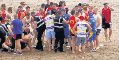  ??  ?? Shocking violence erupts at the Swansea beach rugby tournament