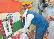  ??  ?? CM Jai Ram Thakur pays floral tributes to Galwan Valley martyr Ankush Thakur at his village in Hamirpur on Saturday. HT PHOTO