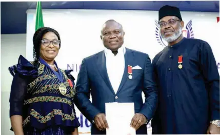  ?? ?? Acting. President Nigeria Institute of Management ( NIM), Dr ( Mrs) Christiana V. Atako ( left); Former Lagos State Governor, Akinwunmi Ambode and Ag. Registrar, NIM, Jude Ihenacho during the NIM Fellowship Award Ceremony at the weekend in Lagos.