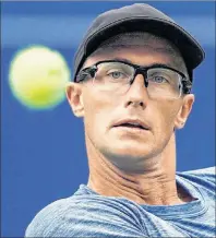  ?? CP PHOTO ?? Peter Polansky of Canada returns a shot to Novak Djokovic of Serbia during second round men’s Rogers Cup tennis tournament action in Toronto, Wednesday, August 8. Polansky has made tennis history by becoming the first player to advance to all four Grand Slams in a calendar year as a lucky loser.