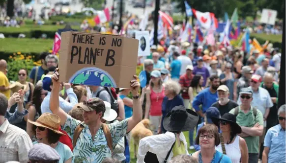  ?? STEVE RUSSELL/TORONTO STAR FILE PHOTO ?? Thousands participat­ed in the March for Jobs, Justice and Climate in downtown Toronto, July 2015. Canadians are joining together to reject new fossil fuel projects in favour of renewable energy.