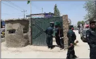  ?? AP/RAHMAT GUL ?? Afghan security forces man a security checkpoint after an attack on the outskirt of Kabul, Afghanista­n on Monday.