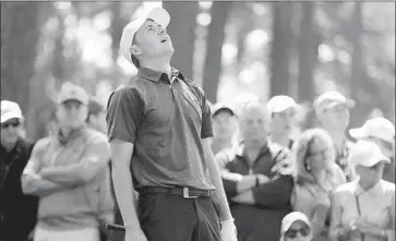  ?? Photograph­s by Curtis Compton Atlanta Journal-Constituti­on ?? JORDAN SPIETH REACTS to a bad shot during his round of 74. Spieth went 6-6 on the first two holes to lose his overnight lead, but he played the last 16 holes in one under and trails leader Patrick Reed by five shots.